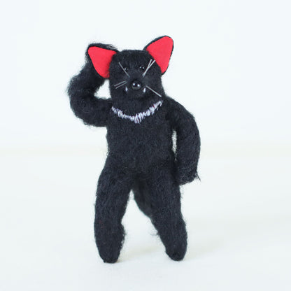 Artisan Tasmanian devil plush doll standing upright in a characterful, playful pose, with embroidered white chest detail.